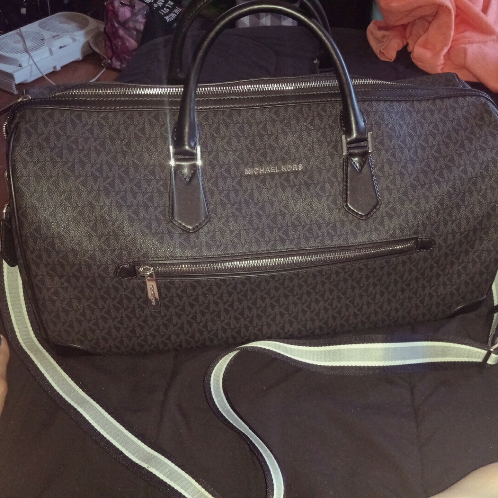 Michael Kors travel luggage bag.